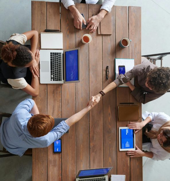 Business partners working together across a shared marketing plan